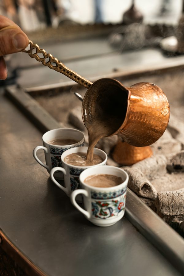 Authentic Turkish coffee brewed in copper cezve with rich foam